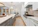 Bright, open kitchen with island seating, chef's appliances, and connection to dining area at 120 25Th N Ave, St Petersburg, FL 33704