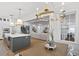 Open-concept kitchen and living room with a large island, stainless appliances, and hardwood flooring at 120 25Th N Ave, St Petersburg, FL 33704