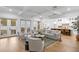 Open-concept living area with coffered ceilings and seamless connection to the kitchen and outdoor space at 120 25Th N Ave, St Petersburg, FL 33704