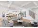 Open-concept living room with a view into the kitchen, creating a seamless flow for entertaining at 120 25Th N Ave, St Petersburg, FL 33704