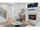 Bright and airy living room featuring a fireplace, elegant decor, and staircase access at 120 25Th N Ave, St Petersburg, FL 33704