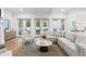Spacious living area with coffered ceilings, French doors, and stylish furnishings for relaxation at 120 25Th N Ave, St Petersburg, FL 33704