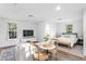 Bright living area with large windows, a comfortable seating area, and a cozy bedroom space at 120 25Th N Ave, St Petersburg, FL 33704