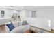 Bright living room featuring a modern design with a stylish sofa and a kitchenette at 120 25Th N Ave, St Petersburg, FL 33704