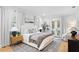 Serene bedroom with hardwood floors, stylish décor, and French doors to outdoor area at 120 25Th N Ave, St Petersburg, FL 33704