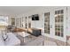 Inviting outdoor patio featuring comfortable seating, a TV, and multiple access doors for indoor-outdoor living at 120 25Th N Ave, St Petersburg, FL 33704
