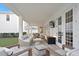 Covered patio featuring brick flooring, comfortable seating, and an outdoor television for entertainment at 120 25Th N Ave, St Petersburg, FL 33704