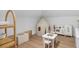 Bright playroom with a play kitchen, table, tent, and organization shelves, designed for imaginative play at 120 25Th N Ave, St Petersburg, FL 33704