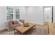 Cozy sitting room with a comfortable chair, patterned rug, and natural light at 120 25Th N Ave, St Petersburg, FL 33704
