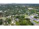 Aerial view showing home's location in a residential neighborhood with lush tree coverage at 1214 E Curtis St, Tampa, FL 33603