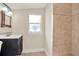 Clean bathroom with tile shower and updated vanity at 1214 E Curtis St, Tampa, FL 33603
