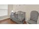 Bright Bedroom with crib and rocking chair at 1214 E Curtis St, Tampa, FL 33603