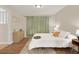 Cozy bedroom with light walls and wood floors at 1214 E Curtis St, Tampa, FL 33603