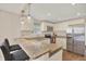 Updated kitchen with granite countertops and stainless steel appliances at 1214 E Curtis St, Tampa, FL 33603