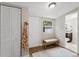 Laundry room with built-in storage and bench at 1214 E Curtis St, Tampa, FL 33603
