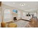 Open living room with hardwood floors and view into kitchen at 1214 E Curtis St, Tampa, FL 33603