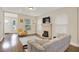 Bright living room featuring hardwood floors and a fireplace at 1214 E Curtis St, Tampa, FL 33603