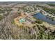 Community pool and surrounding landscape at 12218 Fox Chase Dr # G2, Hudson, FL 34669