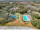 Community pool, tennis court, and condo buildings at 12218 Fox Chase Dr # G2, Hudson, FL 34669