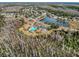 Community pool and surrounding landscape at 12218 Fox Chase Dr # G2, Hudson, FL 34669