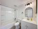 Updated bathroom with a white vanity, bathtub, and modern fixtures at 12218 Fox Chase Dr # G2, Hudson, FL 34669
