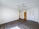 Spacious bedroom with wood-look floors and en-suite bath at 12218 Fox Chase Dr # G2, Hudson, FL 34669