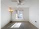 Well-lit bedroom with window, ceiling fan, and carpet floors at 12218 Fox Chase Dr # G2, Hudson, FL 34669