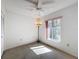 Spacious bedroom with large window, ceiling fan, and carpet flooring at 12218 Fox Chase Dr # G2, Hudson, FL 34669