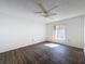 Bedroom with wood-look floors and ceiling fan at 12218 Fox Chase Dr # G2, Hudson, FL 34669
