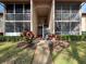 Condo building entryway with stairs and plants at 12218 Fox Chase Dr # G2, Hudson, FL 34669