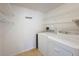 Laundry room with shelving and full-size washer/dryer at 12218 Fox Chase Dr # G2, Hudson, FL 34669