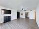 Bright living room with wood-look floors and open kitchen view at 12218 Fox Chase Dr # G2, Hudson, FL 34669