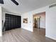 Living room features wood-look floors and kitchen access at 12218 Fox Chase Dr # G2, Hudson, FL 34669