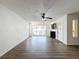 Living room with wood-look floors and sliding doors at 12218 Fox Chase Dr # G2, Hudson, FL 34669