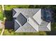 Aerial view of a single-Gathering home with a pool and gray tile roof at 12833 Darby Ridge Dr, Tampa, FL 33624