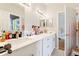 Bathroom with white cabinets and double vanity at 12833 Darby Ridge Dr, Tampa, FL 33624