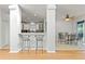 Open kitchen with breakfast bar and view into the adjoining dining area at 12833 Darby Ridge Dr, Tampa, FL 33624
