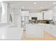 Bright kitchen with white cabinets, stainless steel appliances, and a large island at 12833 Darby Ridge Dr, Tampa, FL 33624