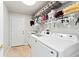 Laundry room with washer, dryer, and ample storage at 12833 Darby Ridge Dr, Tampa, FL 33624