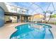 Inviting kidney-shaped pool with a screened enclosure at 12833 Darby Ridge Dr, Tampa, FL 33624