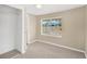 Simple bedroom with closet and window overlooking yard at 1318 E Renfro St, Plant City, FL 33563