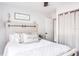 Bedroom with a king-size bed and white color palette at 1398 Shady Pine Way # E3, Tarpon Springs, FL 34688
