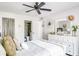 Bedroom with white dresser and en-suite bathroom at 1398 Shady Pine Way # E3, Tarpon Springs, FL 34688