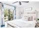 Main bedroom with a king-size bed and serene decor at 1398 Shady Pine Way # E3, Tarpon Springs, FL 34688