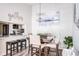 Bright dining area with wooden table and kitchen pass-through at 1398 Shady Pine Way # E3, Tarpon Springs, FL 34688