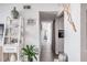 Hallway with coastal decor and access to laundry at 1398 Shady Pine Way # E3, Tarpon Springs, FL 34688