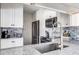 Modern kitchen with stainless steel appliances and granite countertops at 1398 Shady Pine Way # E3, Tarpon Springs, FL 34688