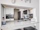 Kitchen features granite countertops and modern appliances at 1398 Shady Pine Way # E3, Tarpon Springs, FL 34688