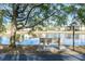 Relaxing bench by a lake, offering scenic views at 1398 Shady Pine Way # E3, Tarpon Springs, FL 34688