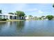 Residential buildings situated along a tranquil lake at 1398 Shady Pine Way # E3, Tarpon Springs, FL 34688